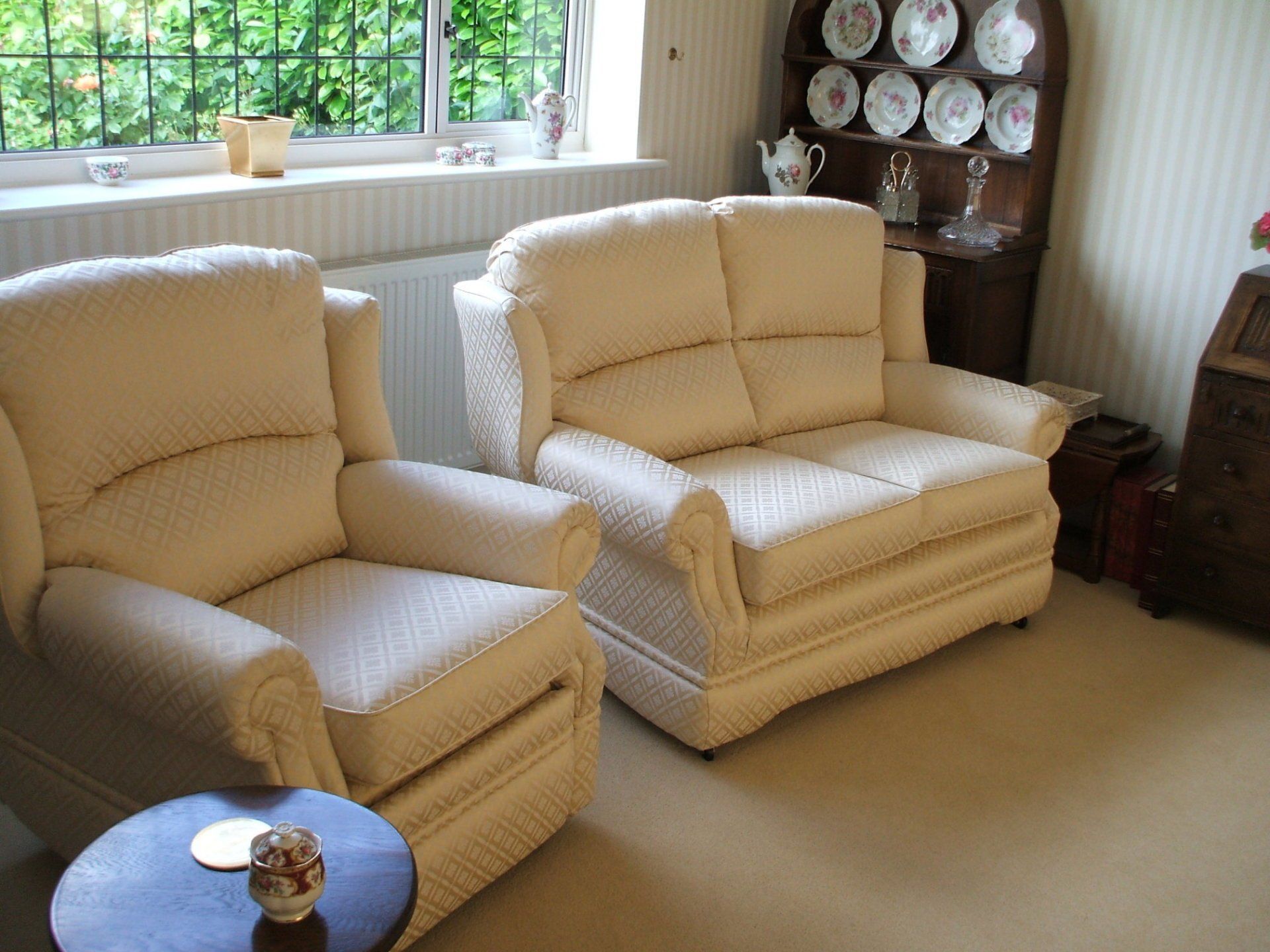 Matching cream leather armchairs in a living room