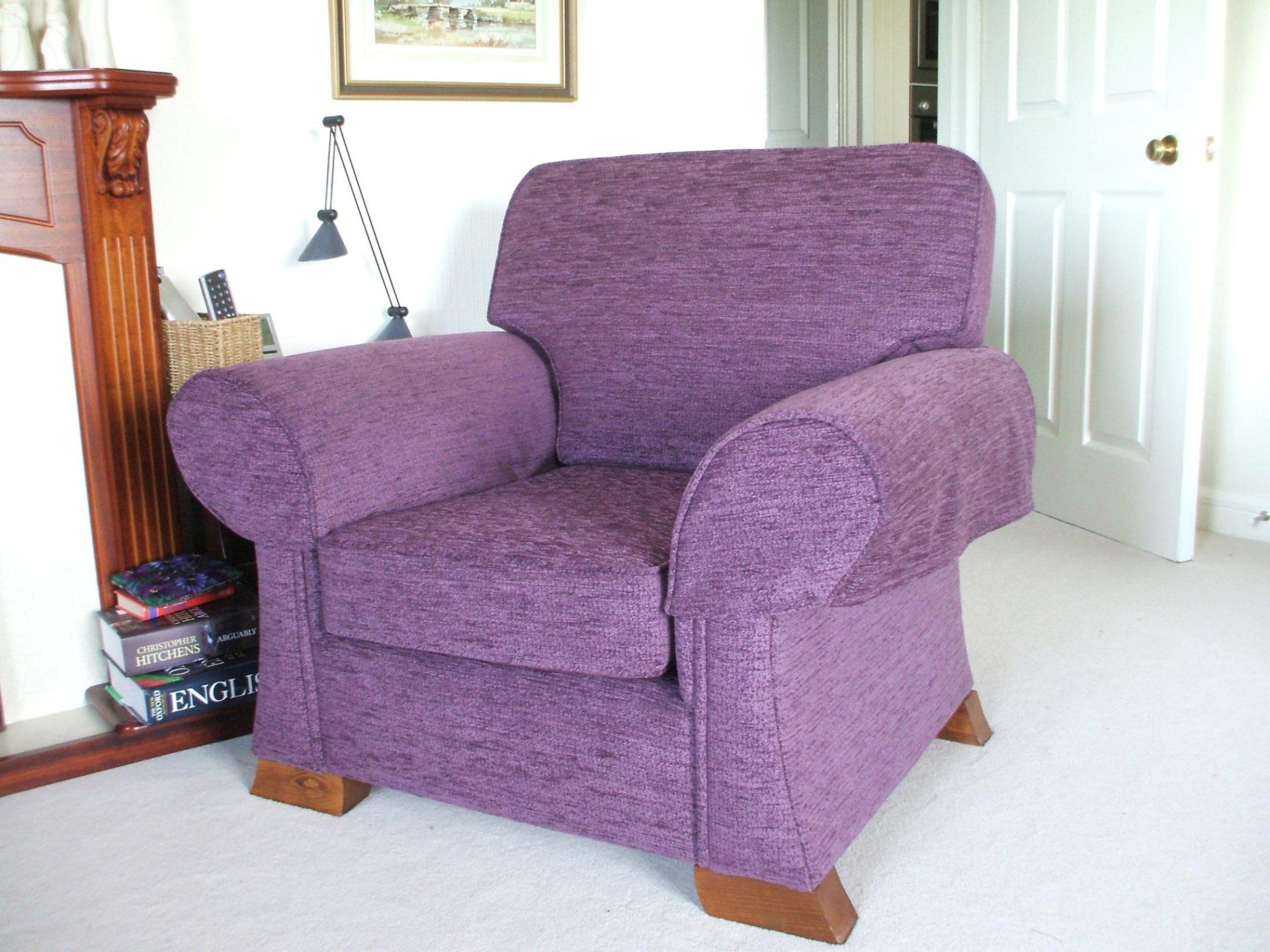 Purple upholstered armchair in a clean home setting